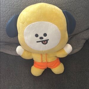 Yellow and Black Plush Toy with Playful Expression